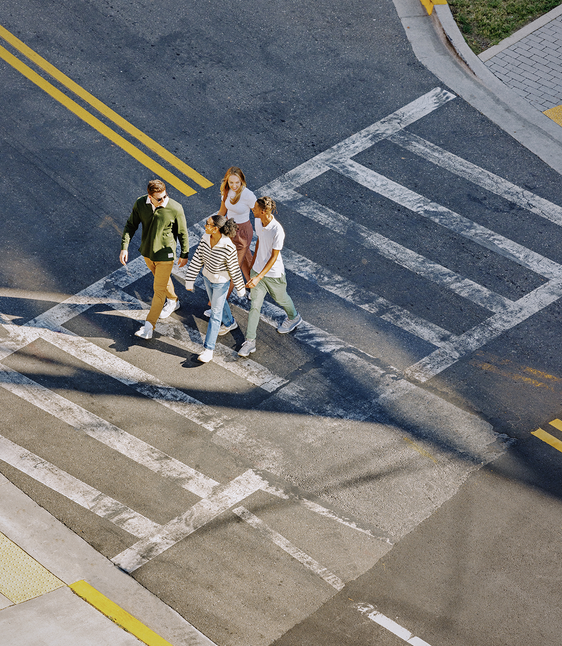 A group of people using a crosswalk