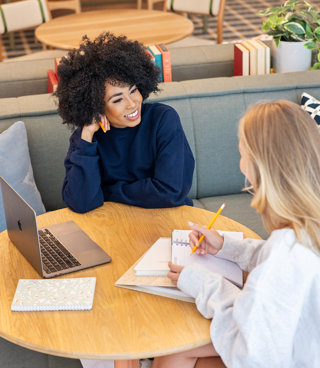 Two friends studying together